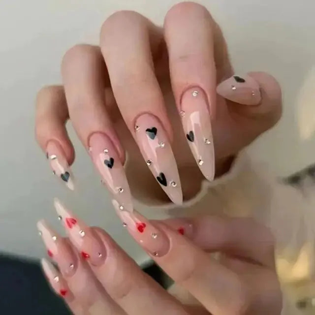 High-shine nude press-on nails with delicate heart accents & crystal details. Keyboard-friendly stiletto shape. Easy application, long-lasting wear. Free shipping.