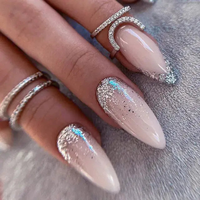 Glossy nude press-ons with holographic silver glitter tips. Keyboard-friendly almond shape. Premium shine & durability. Free shipping.