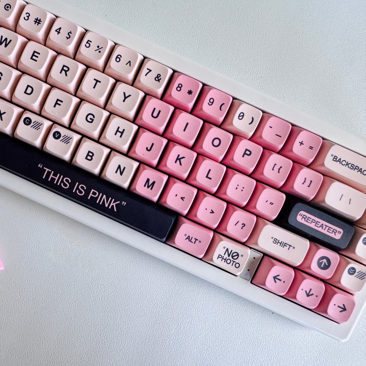 Close-up of our hyper-feminine mechanical keyboard details. Custom pink keycaps with black accents. Part of our coquette aesthetic collection built by Joi.