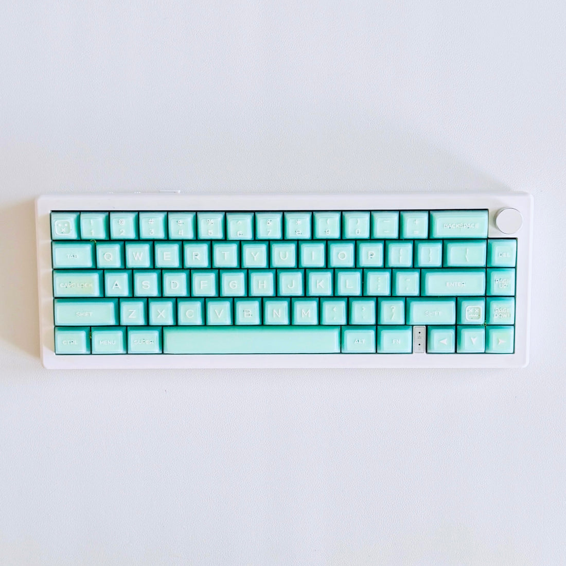 Thocky Keyboard with see-through mint keycaps. Full RGB color keyboard with wireless bluetooth and rechargable support. For Mac or PC.