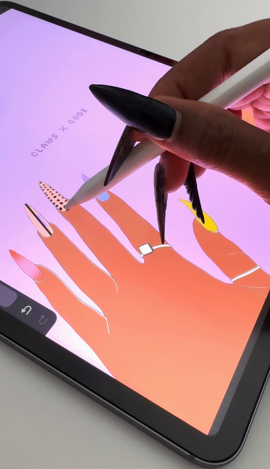 blazing sunset nail design sketched in procreate on ipad, black xl stiletto nails holding apple pencil