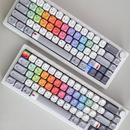 two retro finder compact keyboards with rainbow keys and a volume knob