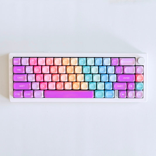 The Sidewalk Chalk mechanical keyboard with pastel gradient keycaps on a rose gold frame