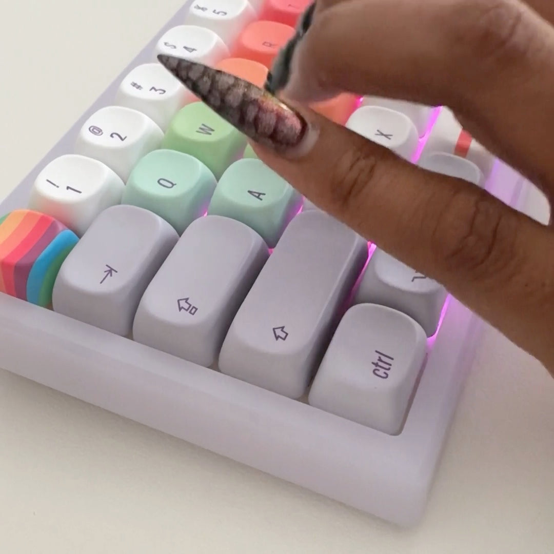 Frost: joi typing on the frost retro finder, glowing purple under rainbow keys